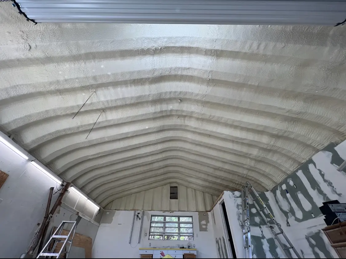 Spray polyurethane foam applied to the underside of a metal roof deck in Palos Hills